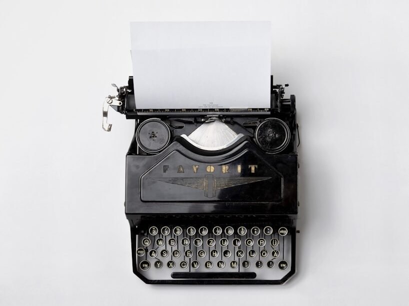 black Fayorit typewriter with printer paper