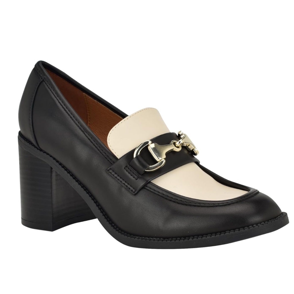 Nine West Koolo women's heeled loafers featuring a high-contrast black and white two-tone leather design, a gold horsebit detail, and a sturdy block heel
