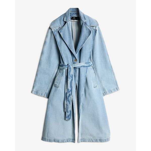 A long, belted 7 For All Mankind denim trench coat in a light wash, featuring a structured collar and relaxed duster length for a modern 2026 style.