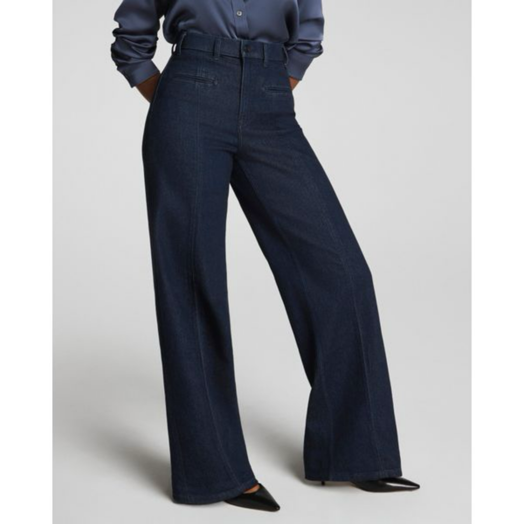 A pair of dark wash high-waisted wide-leg jeans featured on The Posh EdiT as a 2026 spring capsule wardrobe essential.