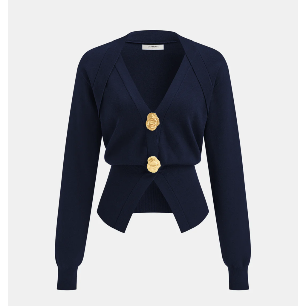 A chic navy blue crewneck cardigan with gold statement buttons, featured on The Posh EdiT as a must-have lightweight knit for a spring capsule wardrobe.