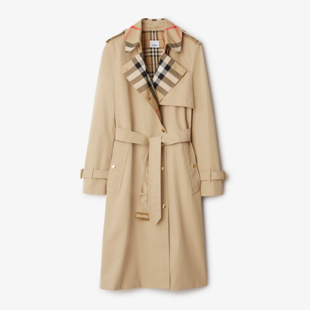 Timeless beige trench coat with a belted waist, double-breasted design, and signature check lining, offering a refined silhouette and polished, versatile style