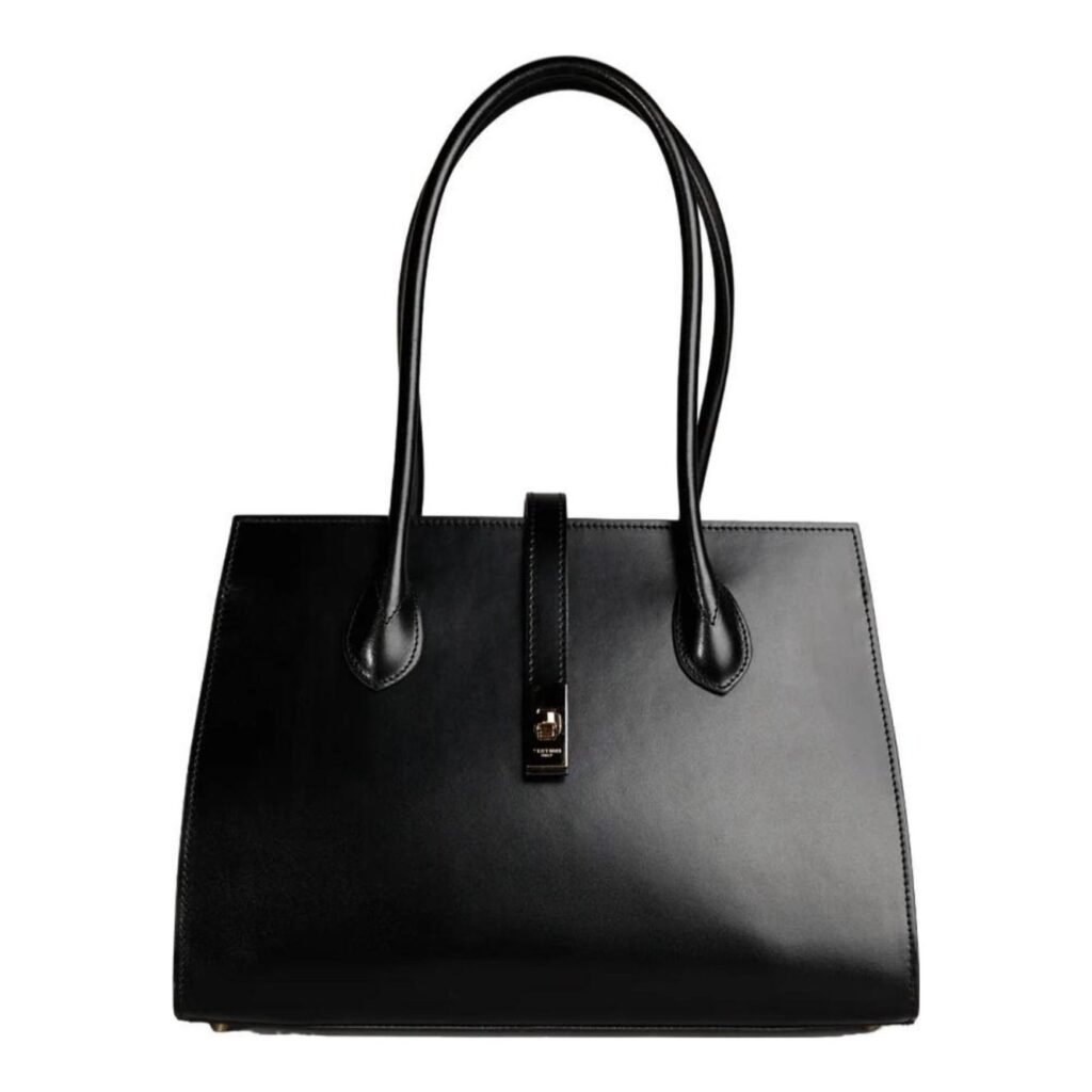 A luxury structured black leather tote bag with gold hardware, featured on The Posh EdiT as a functional spring capsule wardrobe essential.